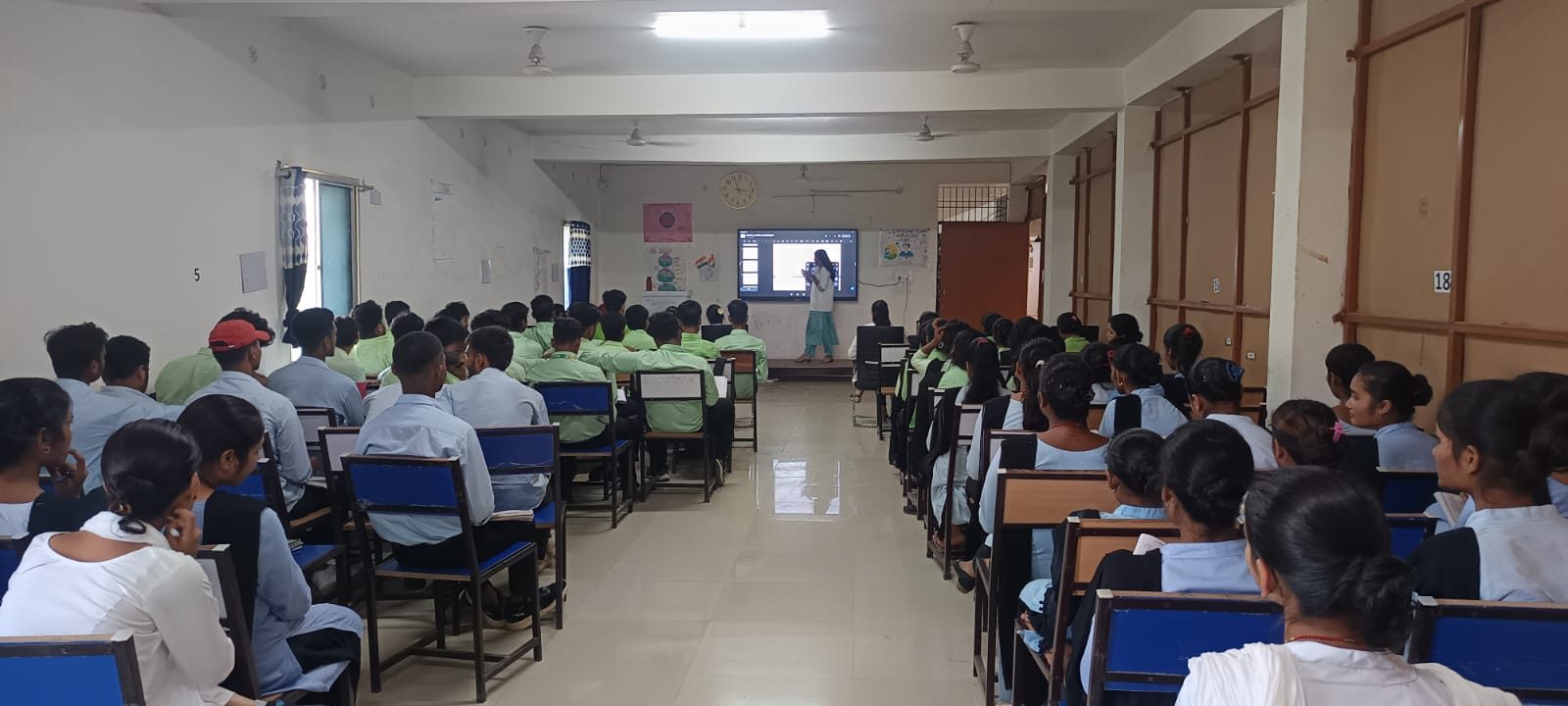Students listening to a session in the lecture hall