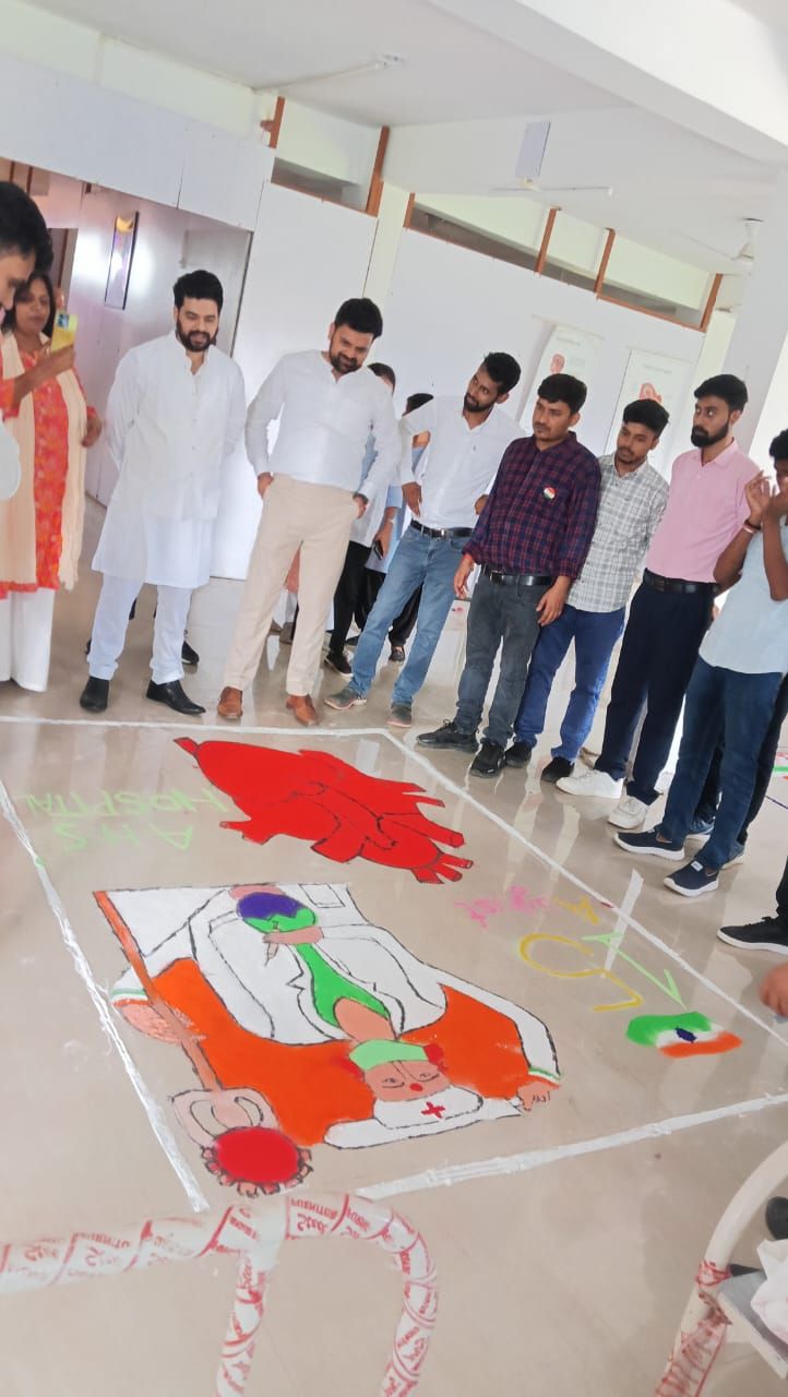 Students around a rangoli