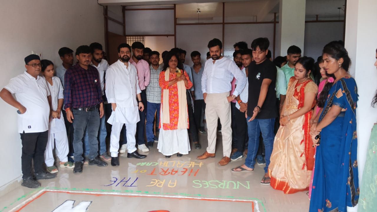 Students and faculty judging the rangolis