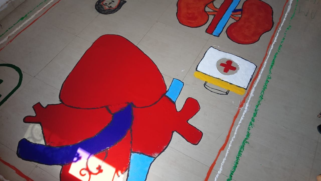 Rangoli of a heart and first-aid kit